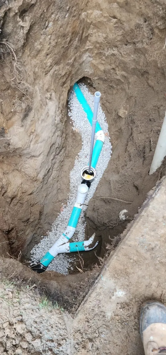 New PVC drain pipe laid in an excavation