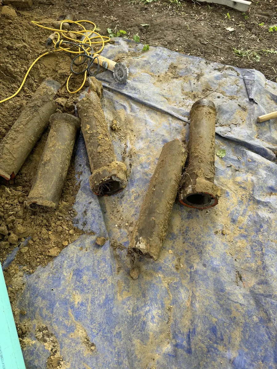 Old drain pipe sections removed from the ground