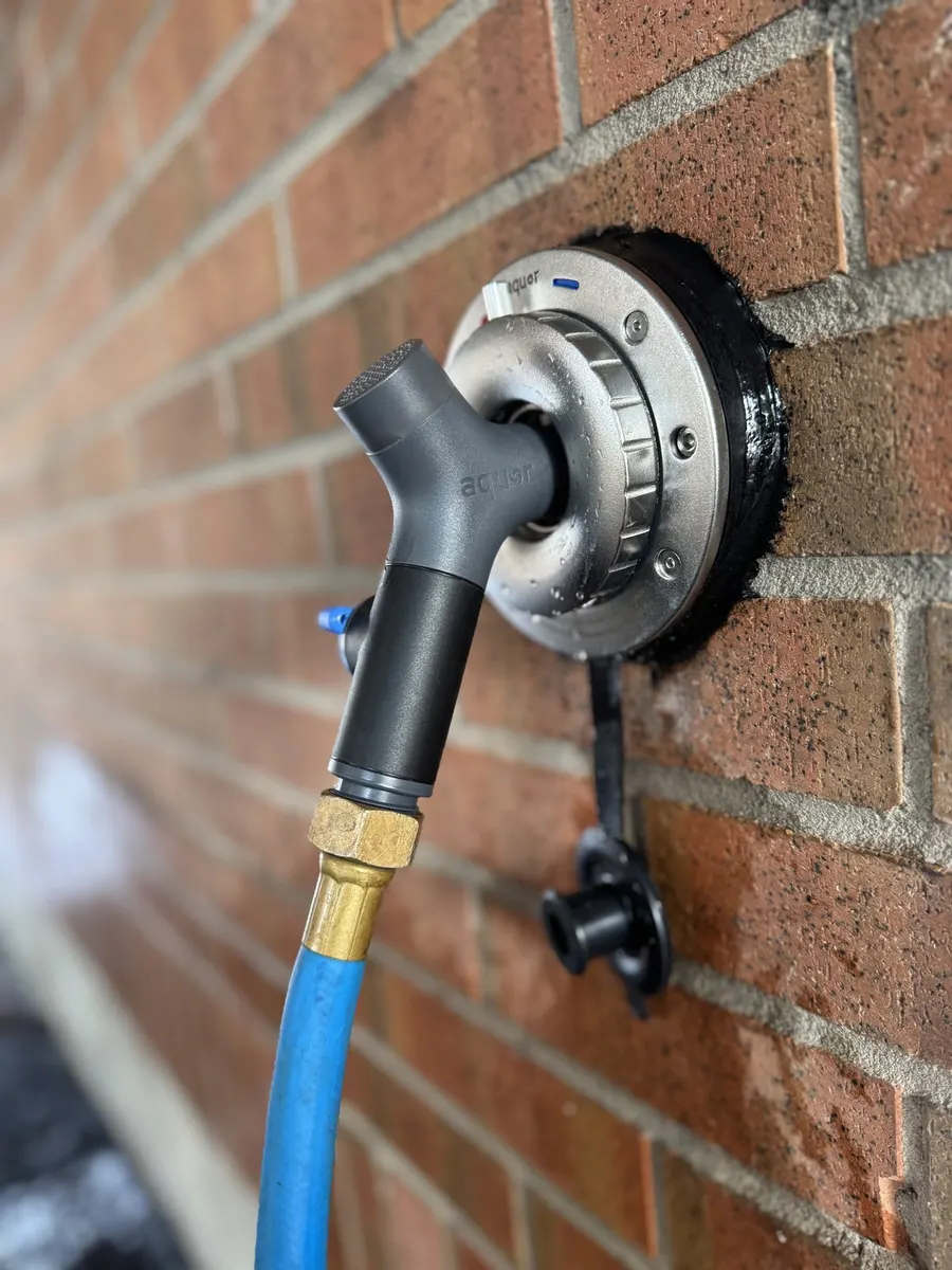 Frost-free outdoor faucet installed on a brick wall