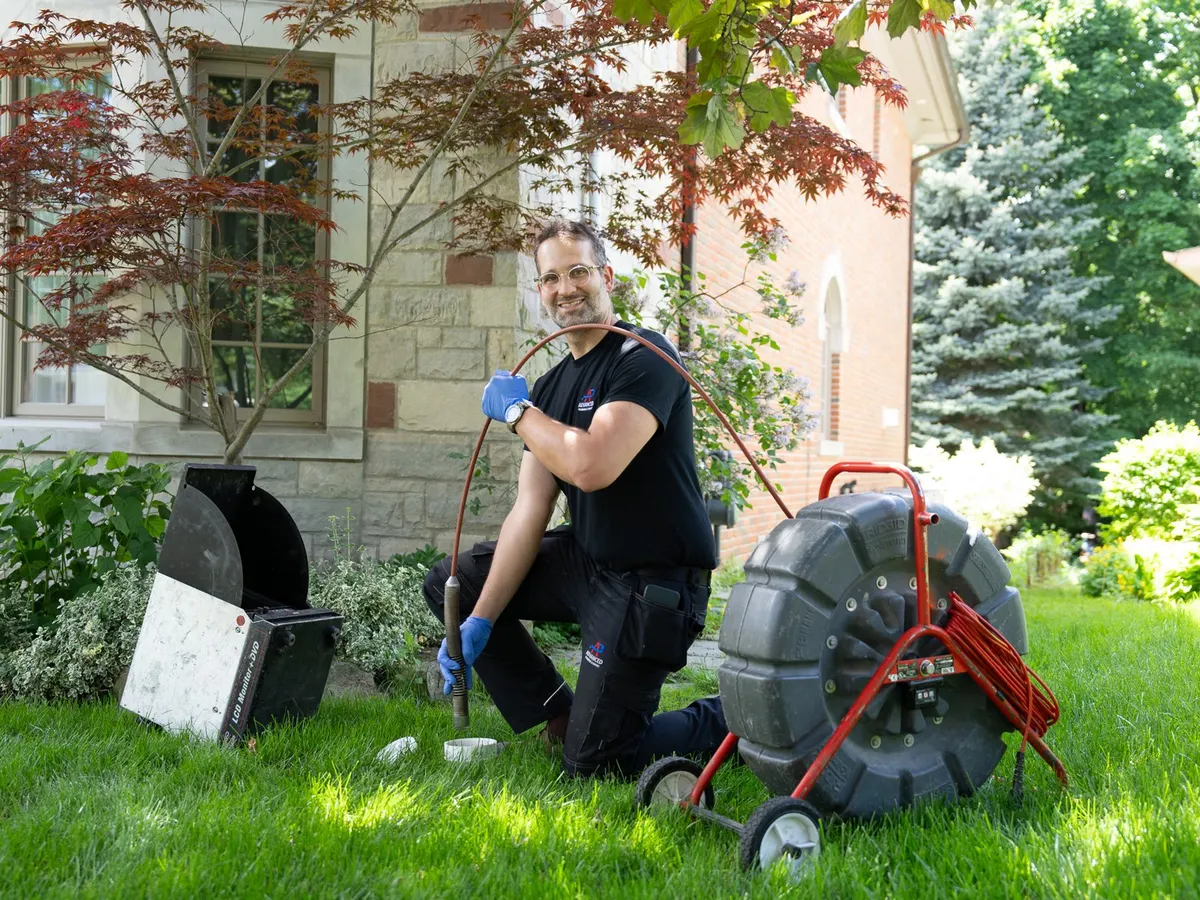 Sewer camera inspection setup on a front lawn