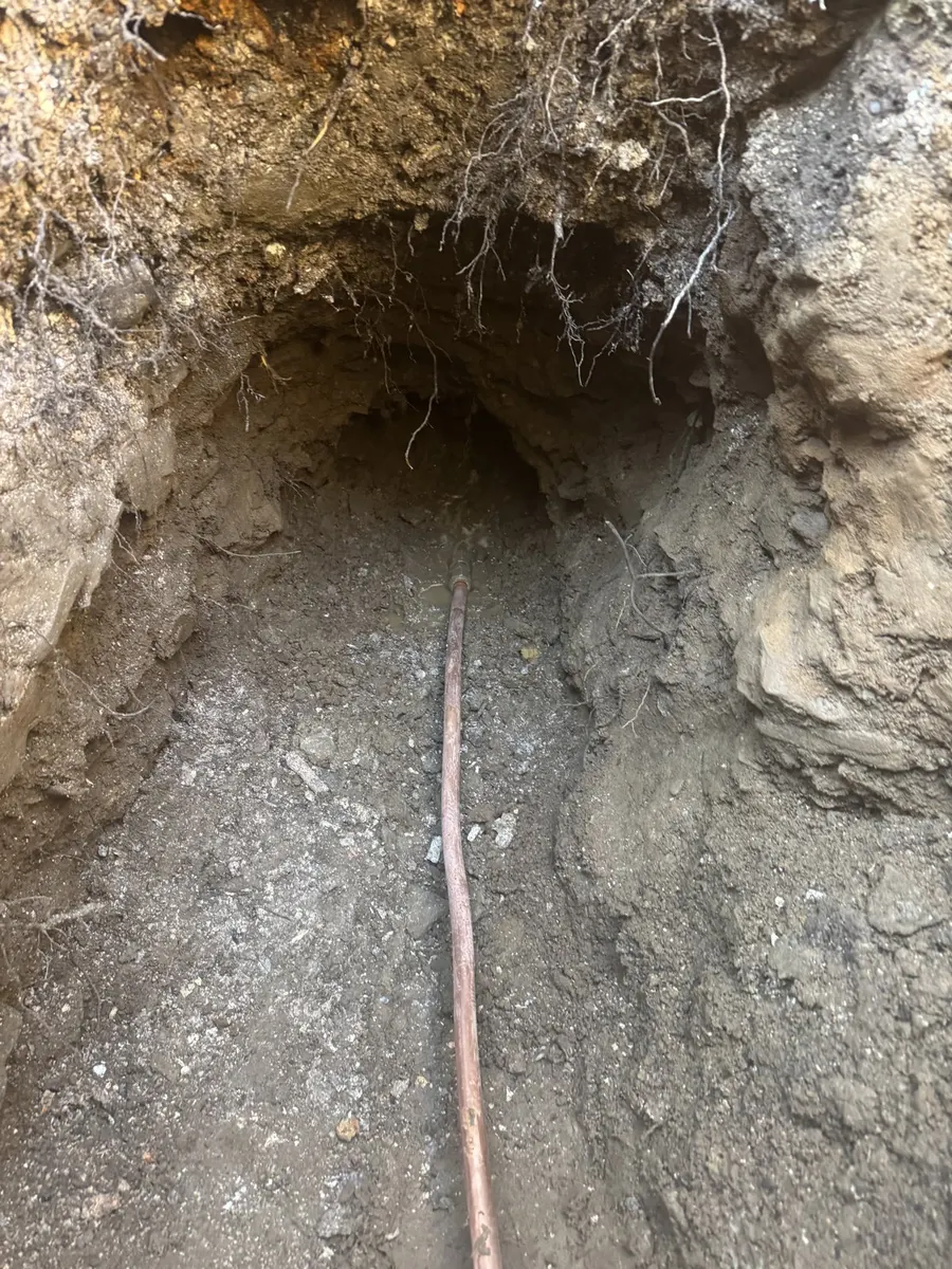 Copper water service line in an open trench